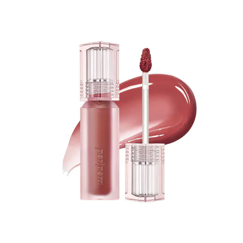 Lip gloss with applicator on a white background