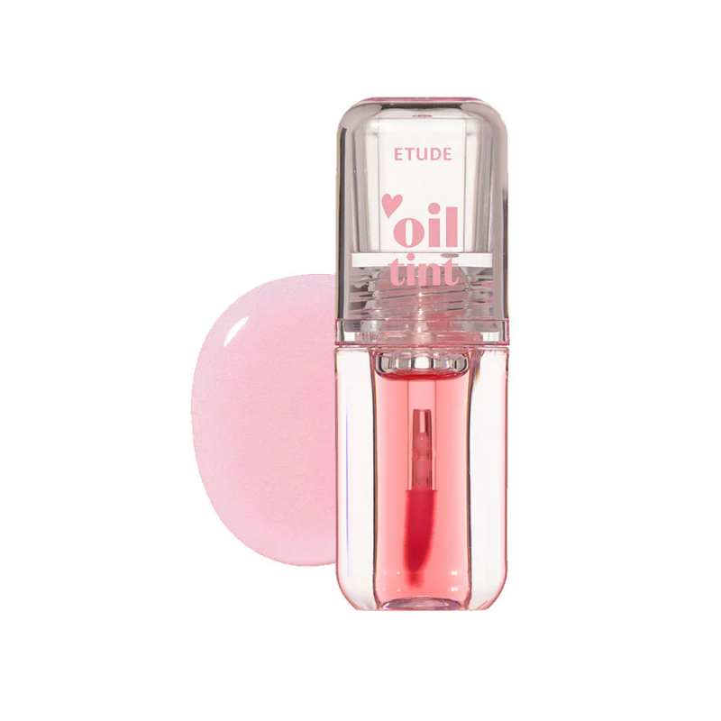 Pink lip tint with clear cap on a white background
