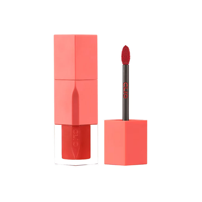 Red lipstick with applicator and packaging on a white background