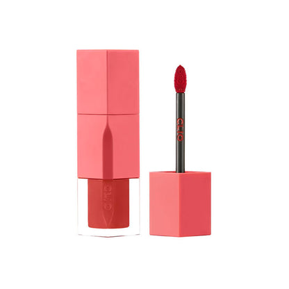Pink lipstick with applicator on a white background