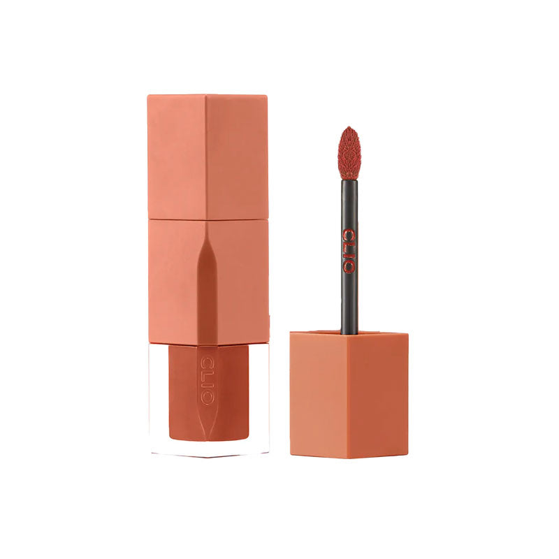 Lipstick with applicator on a white background